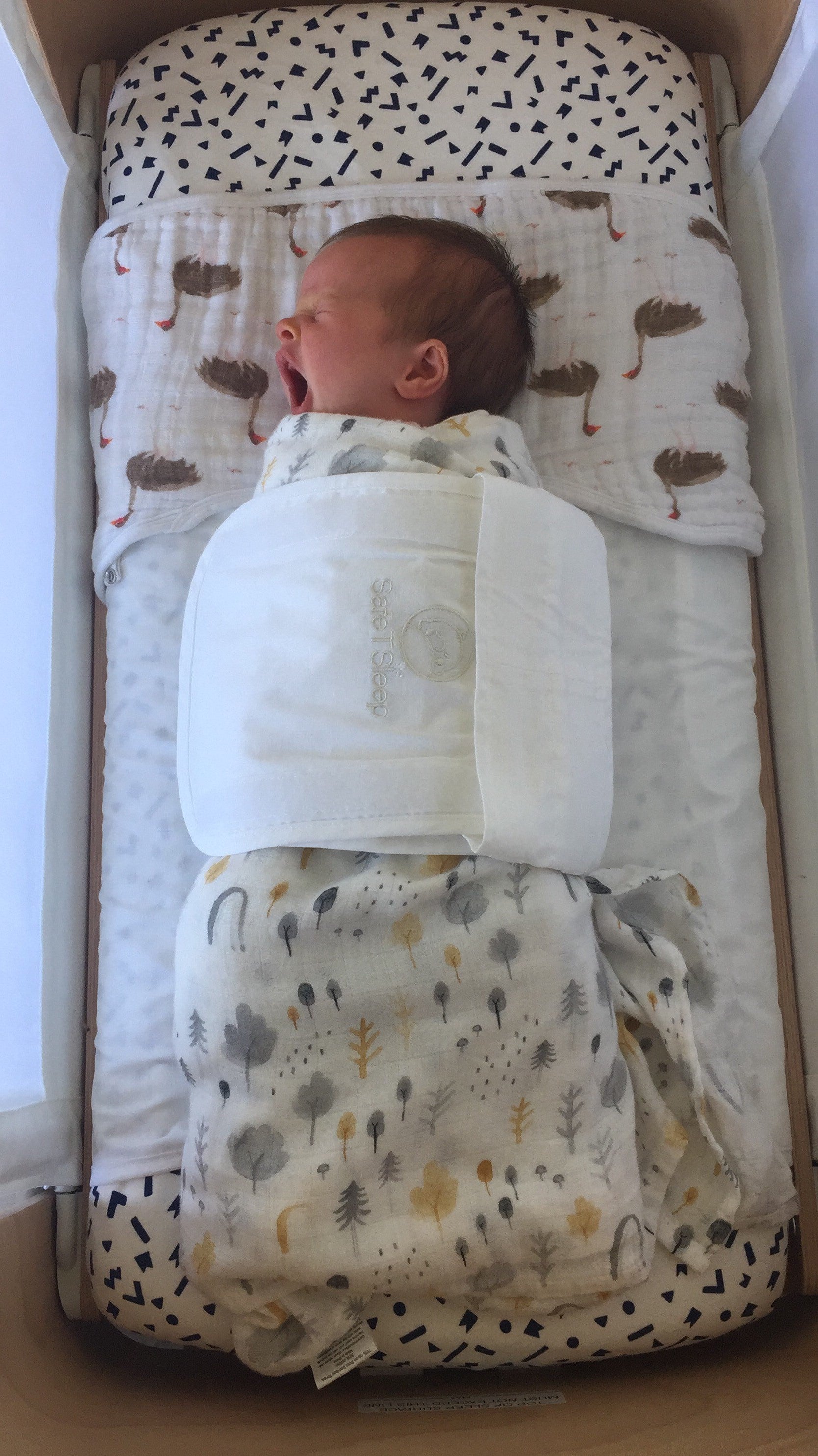 Sleepwrap baby wrap swaddle in a bassinet/cosleeper with a newborn